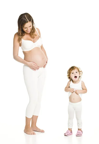 Mujer embarazada con su hija — Foto de Stock