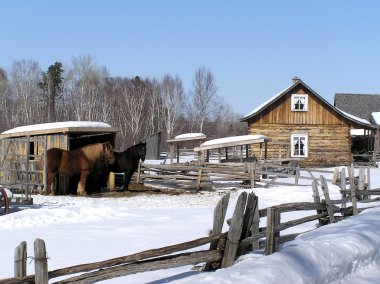 Old farm house and horses clipart