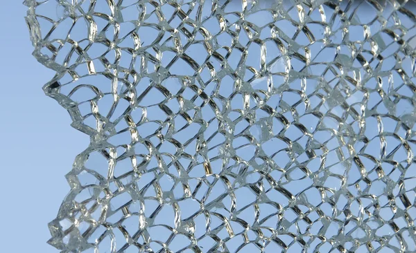 Shattered glass against sky — Stock Photo, Image