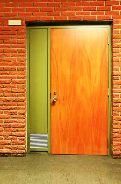 Orange wooden door and bricks clipart