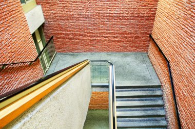 Staircase in brick building clipart