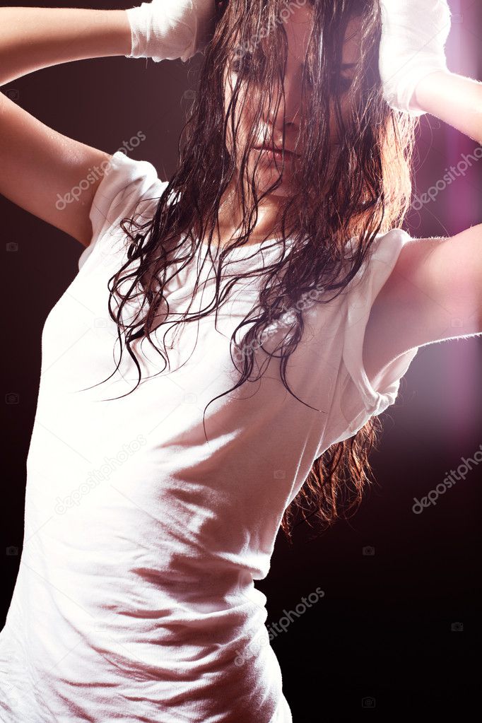 Extreme sports woman stretching in white t-shirt