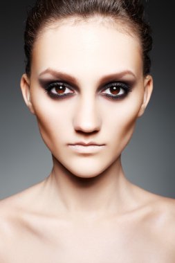 Luxury woman with dark fashion evening smoky make-up clipart