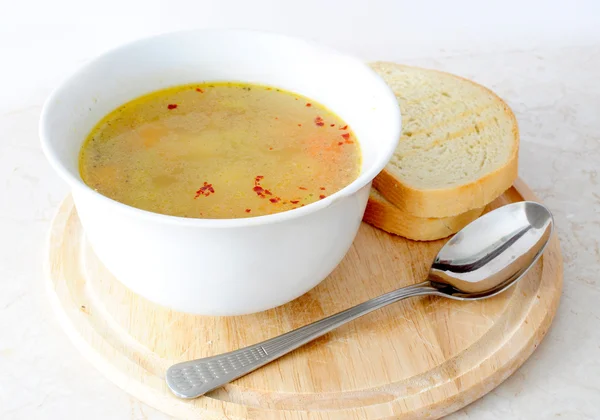 Vegetable / chicken soup with bread and spoon — Stock Photo, Image