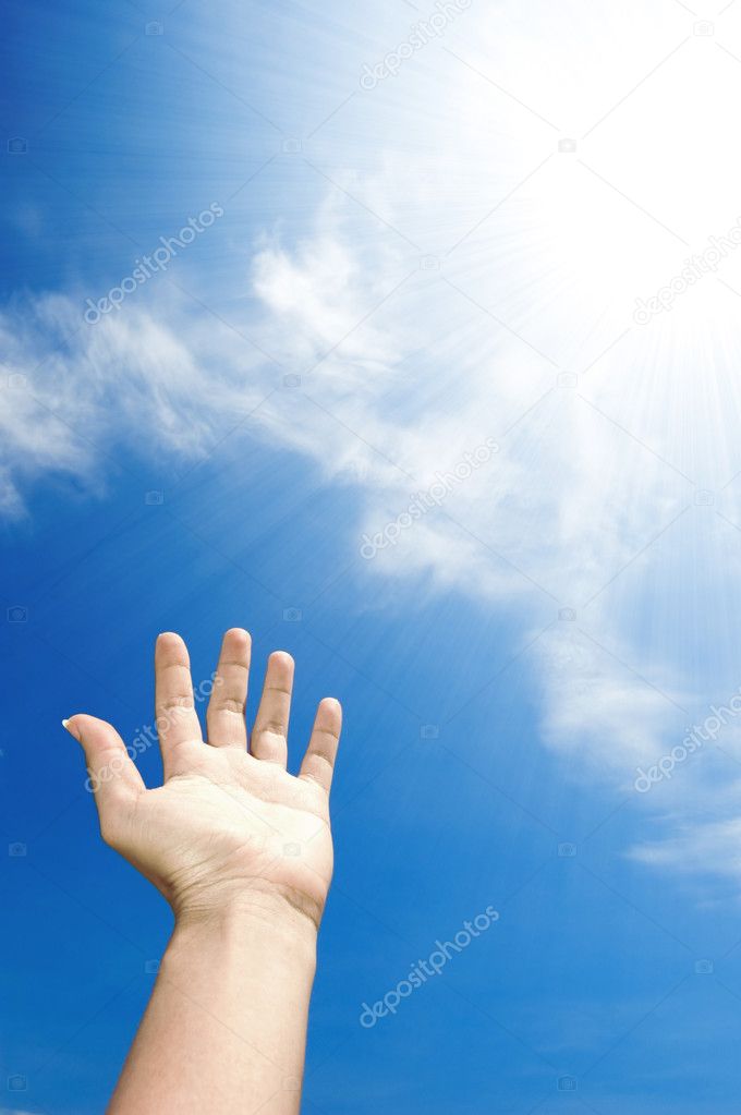 Hand towards sky
