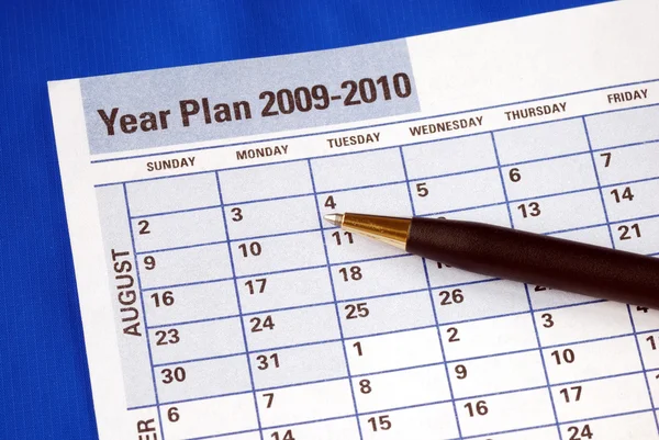 Planejando o ano no planejador do dia — Fotografia de Stock