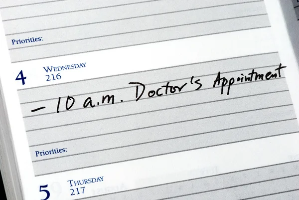 Mark the doctor appointment in the day planner — Stock Photo, Image