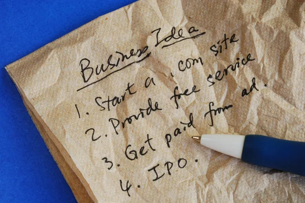 Escreva alguma ideia de negócio criativo em um tecido isolado em azul — Fotografia de Stock