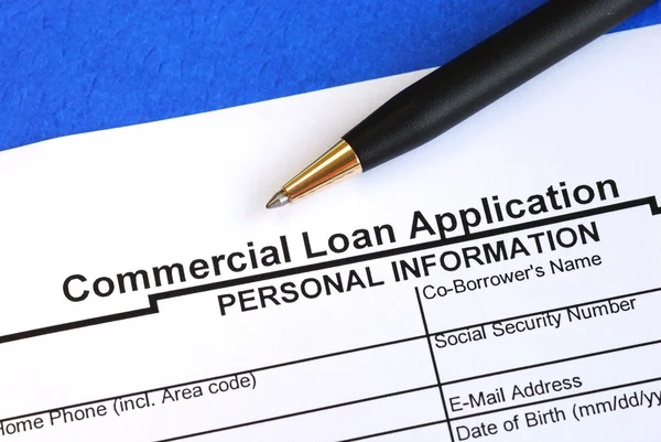 Complete the commercial loan application isolated on blue Royalty Free Stock Images