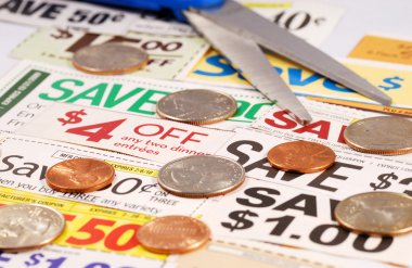Cut up some coupons to save money clipart