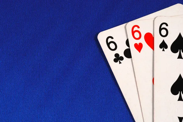 Drie van het nummer zes kaarten concepten van duivel geïsoleerd op blauw — Stockfoto