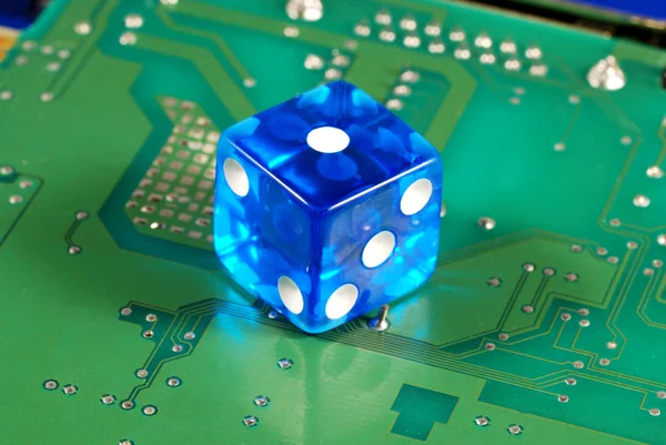 stock image Dice on a computer motherboard concepts of online gambling