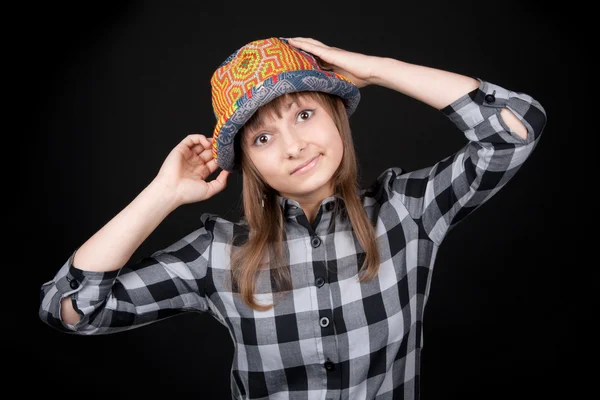 Beautiful girl in colour hat — Stock Photo, Image