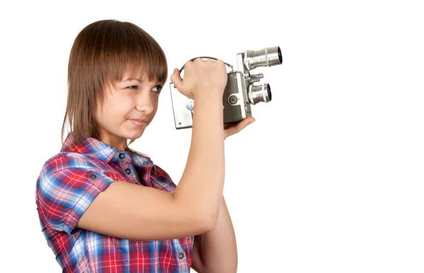 Girl in plaid shirt with movie camera — Stock Photo, Image