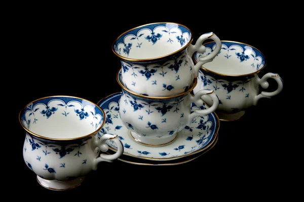 Vier thee cups op schotel — Stockfoto