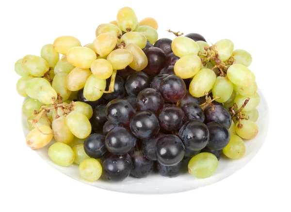 Плита с спелым виноградом — стоковое фото