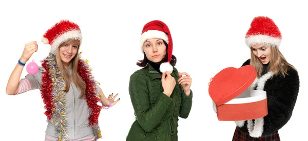 Three girls in cristmas hat with gift — Stock Photo, Image