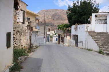 Empty street in mountains village on Crete clipart