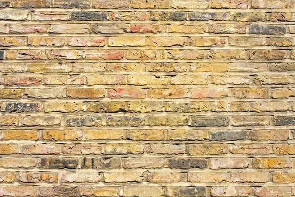 Желтая кирпичная стена — стоковое фото