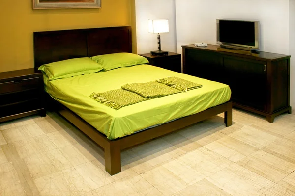 Green double bed — Stock Photo, Image