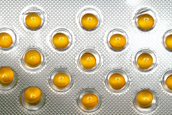 Żółte tabletki — Zdjęcie stockowe