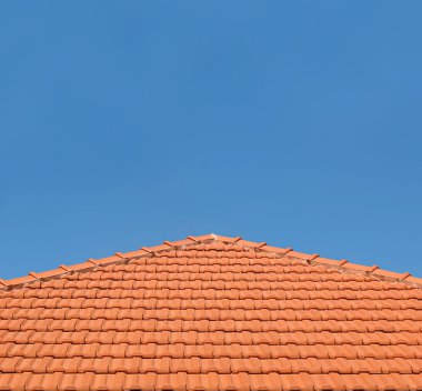 Tiled Rooftop on Blue Sky clipart