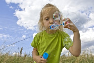 Childrem blowing bubbles clipart