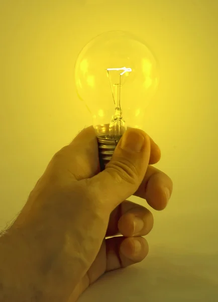 Bulb in hand — Stock Photo, Image