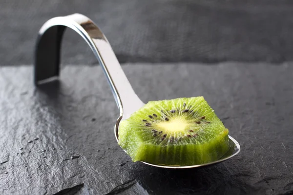 Kiwi on spoon — Stock Photo, Image