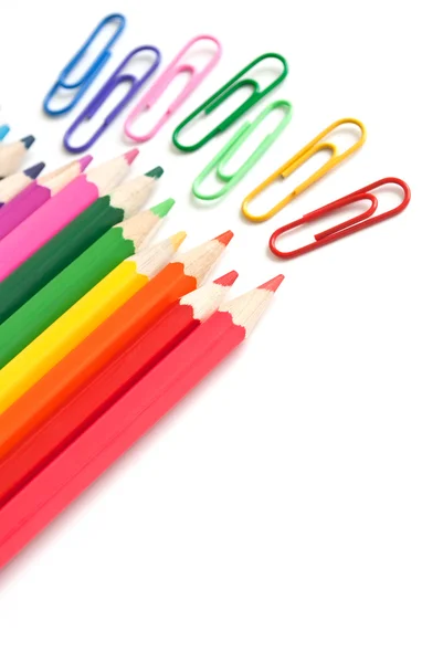 Colorful pencils and paperclips, office stationery Stock Image