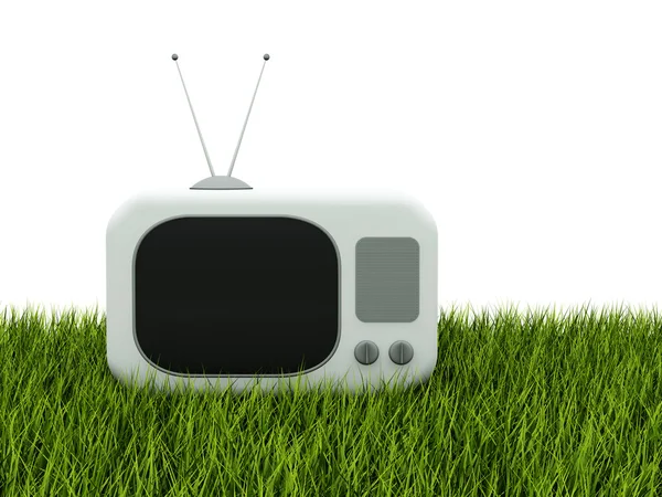 TV na zielonej trawie na białym tle — Zdjęcie stockowe
