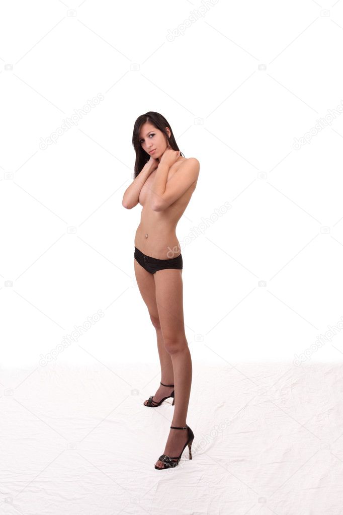 Young caucasian teen woman standing in heels and panties