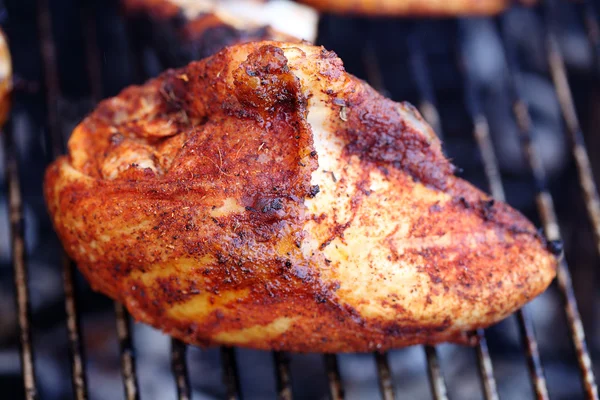 Barbecue chicken breast on grill closeup cooking — Stock Photo, Image