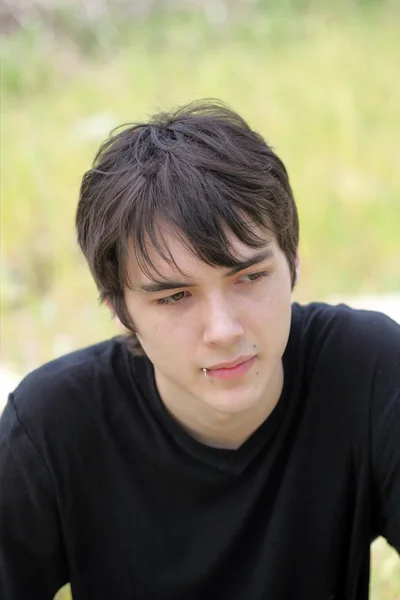 Outdoor portrait of young teen boy black shirt — Stock Photo, Image