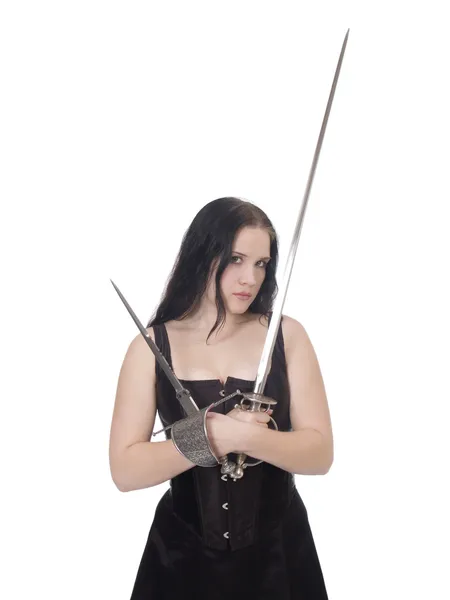 Молодая женщина с мечом и кинжалом в корсете и юбке — стоковое фото