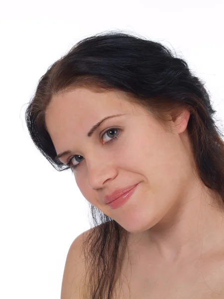 Vrouw staand met blote schouders en lichte glimlach — Stockfoto