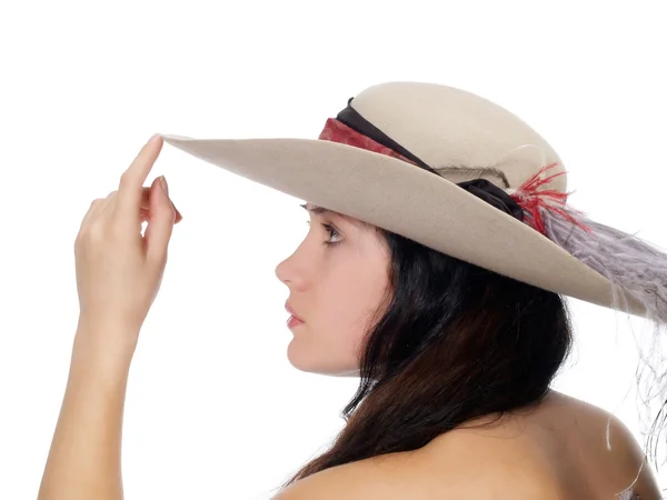 Perfil de mujer joven con el dedo al sombrero — Foto de Stock