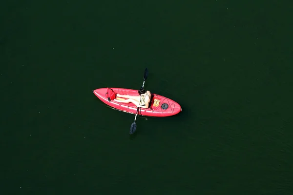 Woman in red kayak and bikini from above — Stock Photo, Image