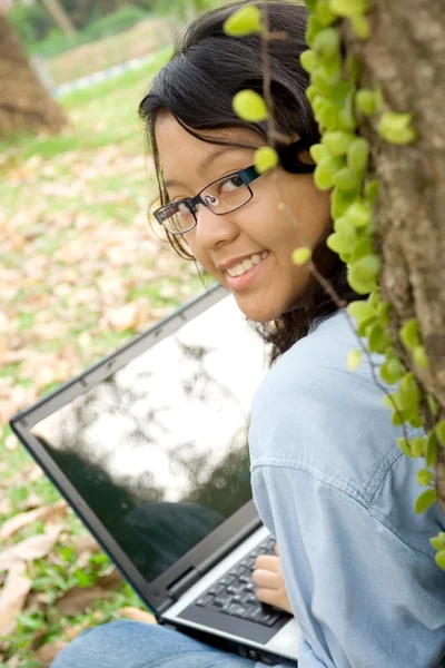 Asian female college student with laptop — Stock Photo, Image