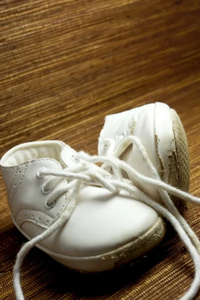 Worn white baby shoes — Stock Photo, Image