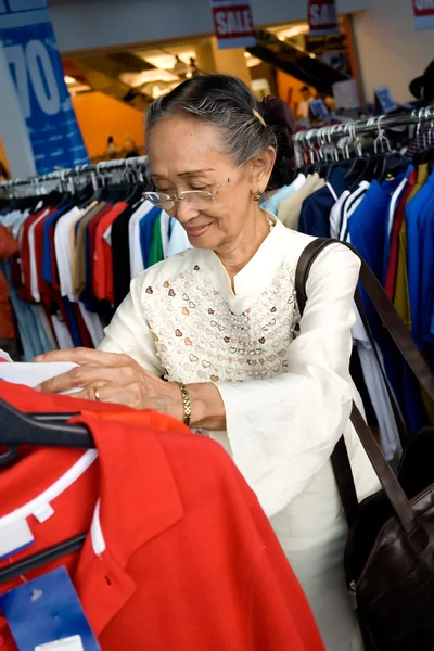Senior woman shopping on sale
