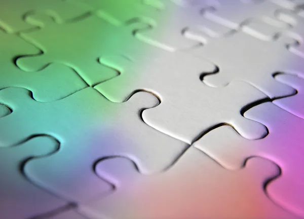 Regenboog gekleurde jigsaw puzzle — Stockfoto