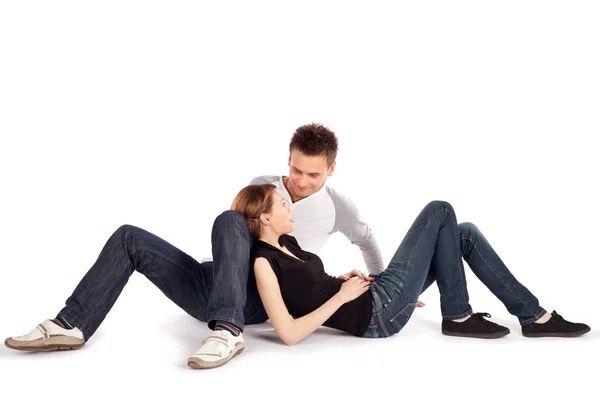 Casual Couple Lying Down on White — Stock Photo, Image