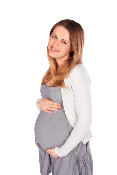 Veselá těhotná žena na bílém pozadí — Stock fotografie