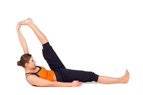 Femme pratiquant la posture de yoga à gros orteils inclinables — Photo