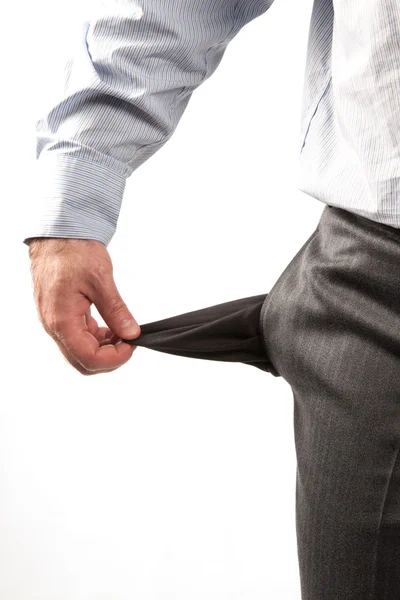Disappointed businessman with empty pockets isolated over white — Stock Photo, Image