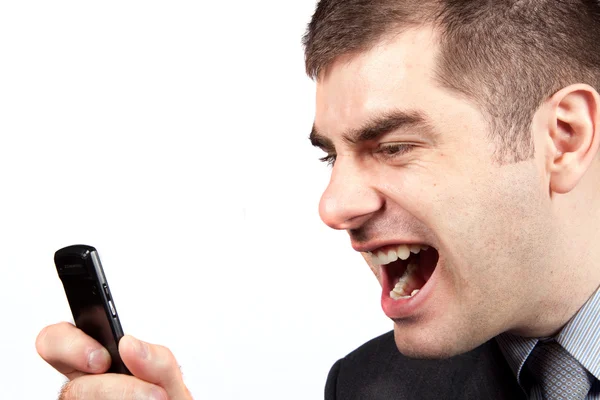 Stressed businessman screaming in telephone — Stock Photo, Image