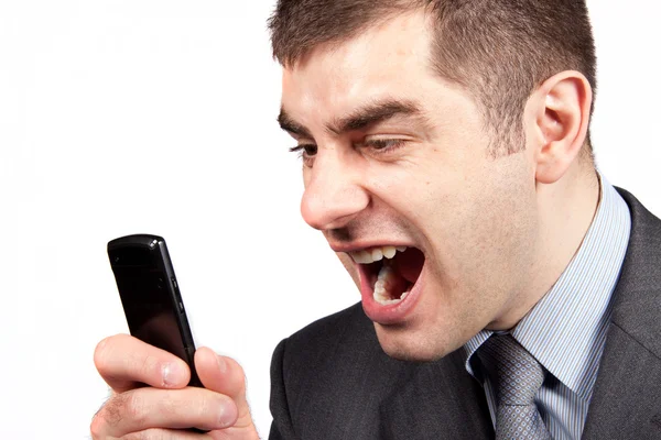 Stressed businessman screaming in telephone — Stock Photo, Image