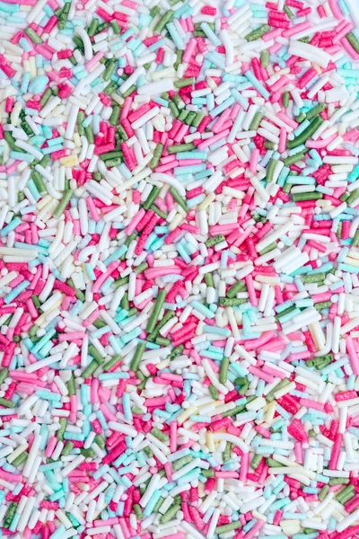 Sprinkles açúcar fundo — Fotografia de Stock