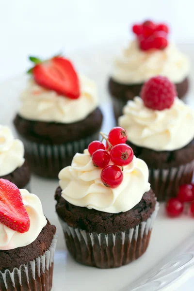 Red berry cupcakes Stock Photo